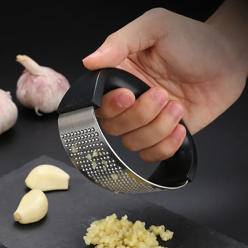 "Stainless Steel Garlic Press – Manual Kitchen Tool" ✅