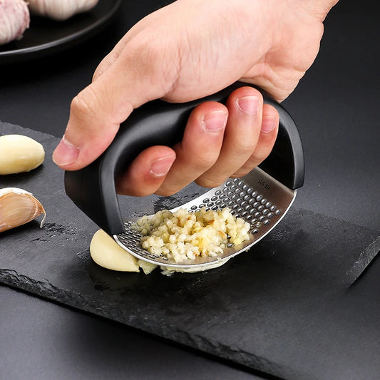 "Stainless Steel Garlic Press – Manual Kitchen Tool" ✅