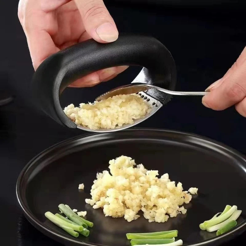 "Stainless Steel Garlic Press – Manual Kitchen Tool" ✅