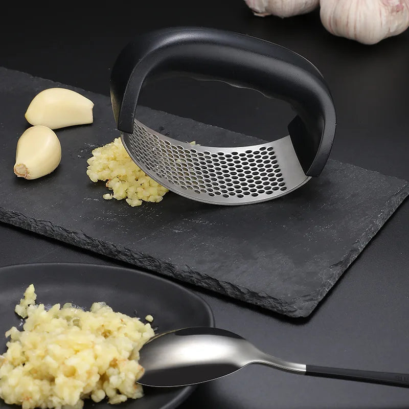 "Stainless Steel Garlic Press – Manual Kitchen Tool" ✅