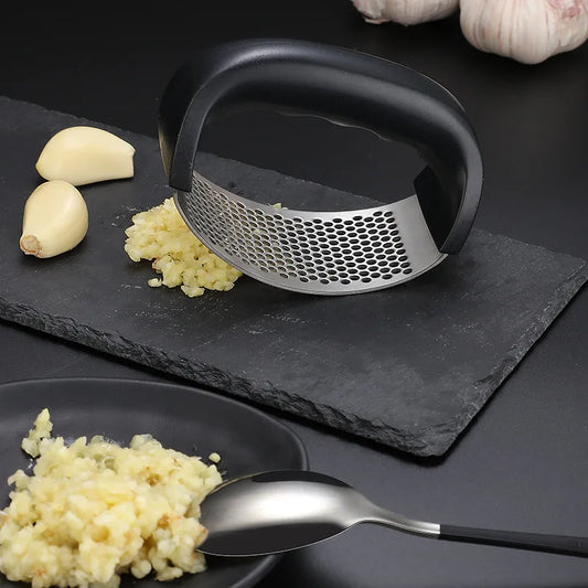 "Stainless Steel Garlic Press – Manual Kitchen Tool" ✅