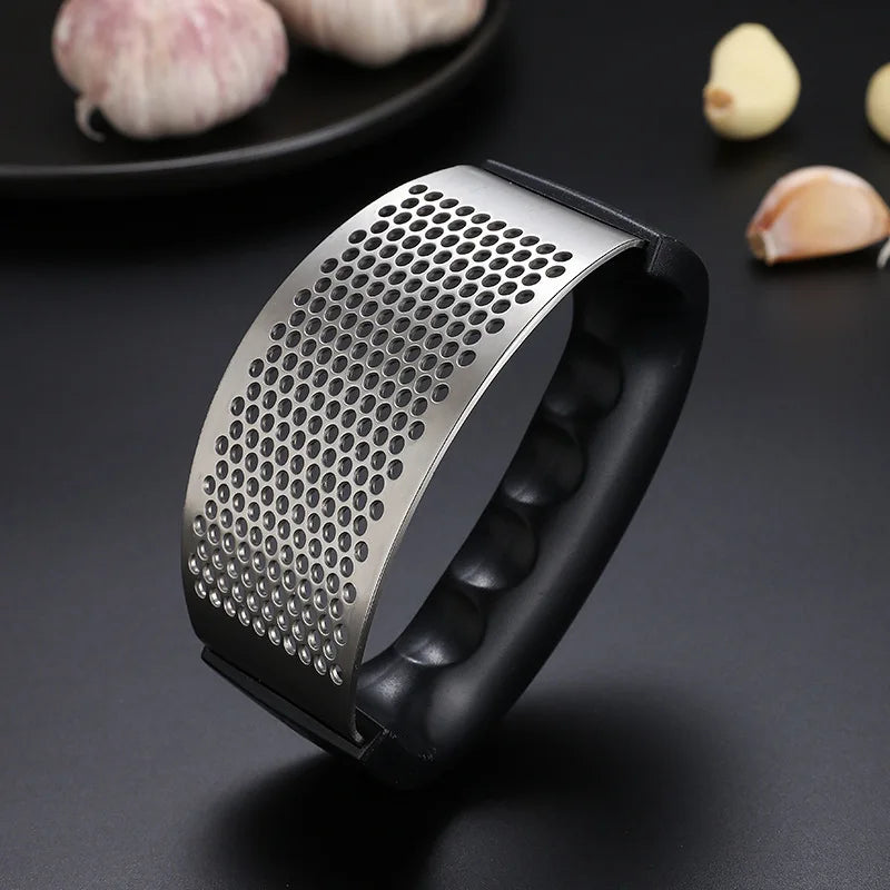 "Stainless Steel Garlic Press – Manual Kitchen Tool" ✅